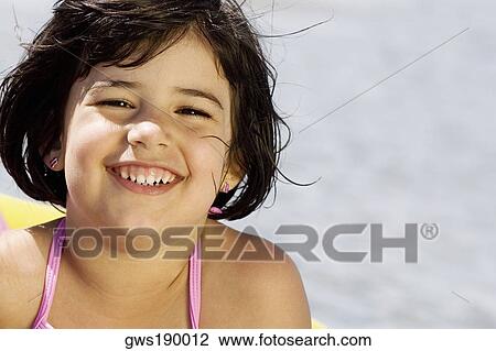 Portrait of a girl smiling View Large Photo Image Stock Image - Portrait of a girl smiling. Fotosearch