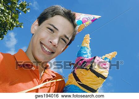 Portrait of a boy smiling with a rocking horse View Large Photo Image Stock Photograph - Portrait of a boy smiling with a rocking horse. Fotosearch