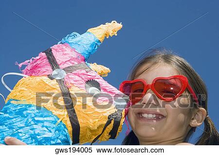 Portrait of a girl holding a rocking horse View Large Photo Image Stock Photography - Portrait of a girl holding a rocking horse. Fotosearch