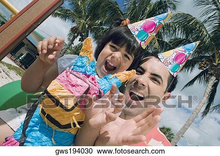 Portrait of a girl laughing with her father View Large Photo Image Stock Image - Portrait of a girl laughing with her father. Fotosearch