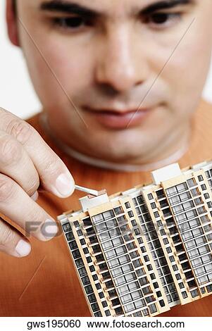 Close-up of an architect holding an architectural model View Large Photo Image Stock Image - Close-up of an architect holding an architectural model. Fotosearch