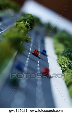 Stock Image - Close-up of an architectural model of a highway with traffic. Fotosearch
