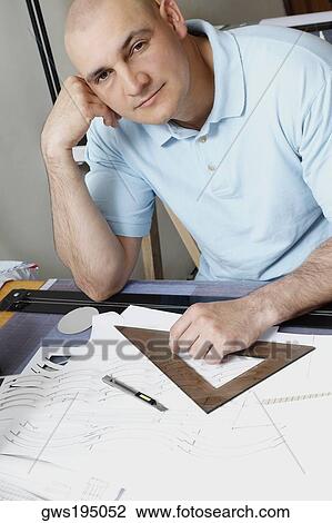 Portrait of a male architect leaning on an elbow View Large Photo Image Stock Image - Portrait of a male architect leaning on an elbow. Fotosearch