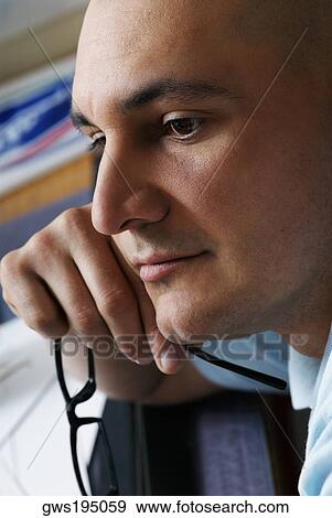 Side profile of a male architect holding eyeglasses and thinking View Large Photo Image Stock Photo - Side profile of a male architect holding eyeglasses and thinking. Fotosearch