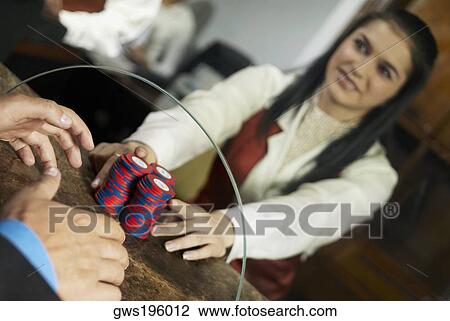 Casino worker giving gambling chips to a man at the checkout counter of a casino View Large Photo Image Stock Image - Casino worker giving gambling chips to a man at the checkout counter of a casino. Fotosearch