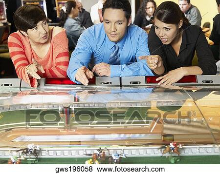 Mature woman with a mid adult man and a teenage girl in a casino View Large Photo Image Stock Photo - Mature woman with a mid adult man and a teenage girl in a casino. Fotosearch