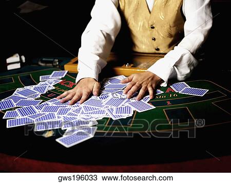 Mid section view of a casino worker shuffling playing cards on a gambling table View Large Photo Image Stock Image - Mid section view of a casino worker shuffling playing cards on a gambling table. Fotosearch