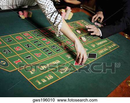 Mid section view of a woman placing gambling chips on a gambling table View Large Photo Image Stock Image - Mid section view of a woman placing gambling chips on a gambling table. Fotosearch