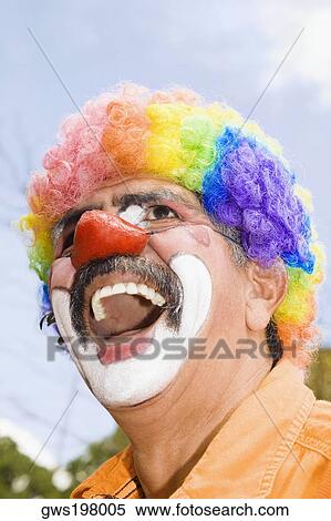 Close-up of a circus clown with a red nose and laughing View Large Photo Image Stock Photography - Close-up of a circus clown with a red nose and laughing. Fotosearch