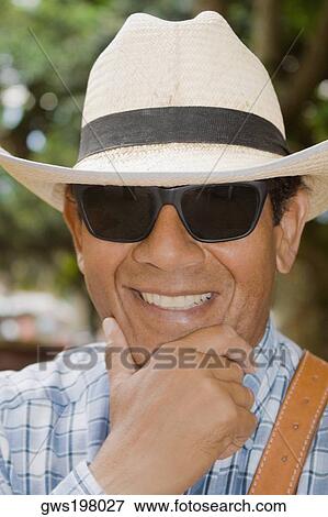 Close-up of a mature man smiling View Large Photo Image Stock Photo - Close-up of a mature man smiling. Fotosearch