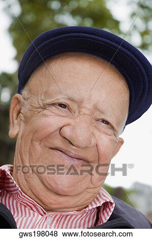Close-up of a senior man smiling View Large Photo Image Stock Photo - Close-up of a senior man smiling. Fotosearch