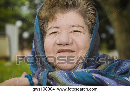 Portrait of a mature woman smiling View Large Photo Image Picture - Portrait of a mature woman smiling. Fotosearch
