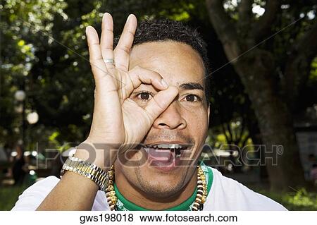 Portrait of a mid adult man pretending to wear glasses View Large Photo Image Stock Photo - Portrait of a mid adult man pretending to wear glasses. Fotosearch