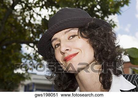 Portrait of a mid adult woman smiling View Large Photo Image Stock Image - Portrait of a mid adult woman smiling. Fotosearch