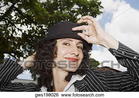 Portrait of a mid adult woman smiling View Large Photo Image Stock Photograph - Portrait of a mid adult woman smiling. Fotosearch