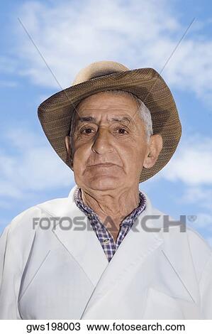 Stock Image - Portrait of a senior man looking serious. Fotosearch