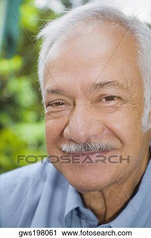 Portrait of a senior man smiling View Large Photo Image Stock Image - Portrait of a senior man smiling. Fotosearch