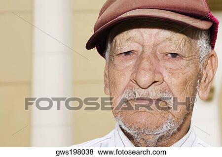 Portrait of a senior man wearing a flat cap View Large Photo Image Stock Photo - Portrait of a senior man wearing a flat cap. Fotosearch