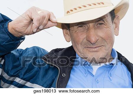 Portrait of a senior man wearing a hat and smiling View Large Photo Image Stock Image - Portrait of a senior man wearing a hat and smiling. Fotosearch
