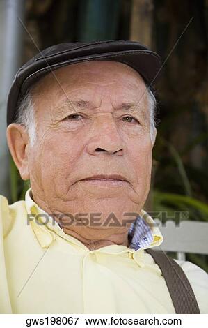 Stock Photo - Portrait of a senior man wearing a hat. Fotosearch