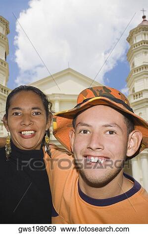 Stock Photo - Portrait of a young couple smiling. Fotosearch