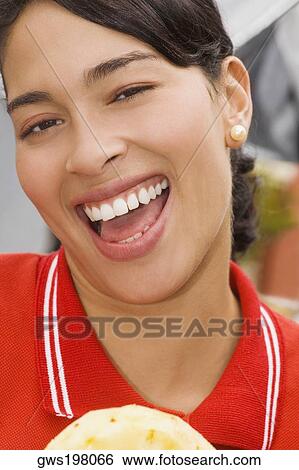 Portrait of a young woman laughing View Large Photo Image Stock Photograph - Portrait of a young woman laughing. Fotosearch