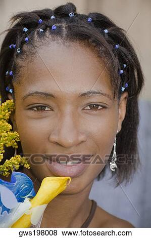 Portrait of a young woman smiling View Large Photo Image Stock Photo - Portrait of a young woman smiling. Fotosearch