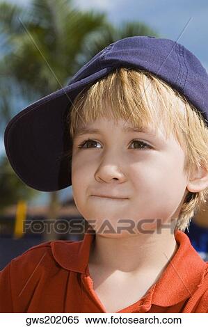 Stock Photography - Close-up of a boy looking away. Fotosearch