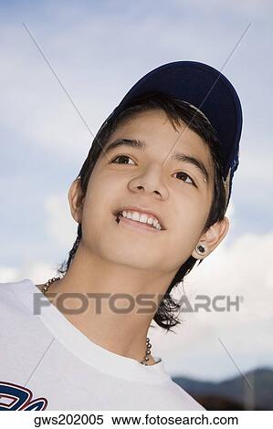 Close-up of a young man smiling View Large Photo Image Stock Photography - Close-up of a young man smiling. Fotosearch