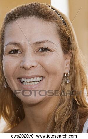 Stock Image - Portrait of a mature woman smiling. Fotosearch