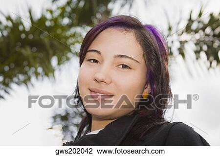 Portrait of a teenage girl smiling View Large Photo Image Stock Image - Portrait of a teenage girl smiling. Fotosearch