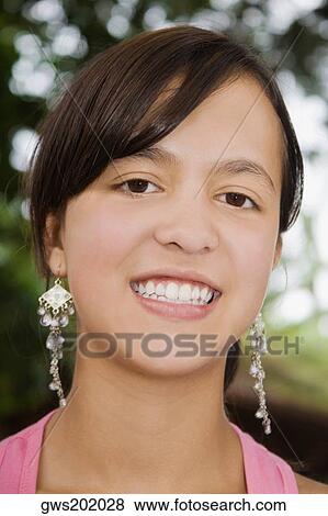 Portrait of a teenage girl smiling View Large Photo Image Stock Photo - Portrait of a teenage girl smiling. Fotosearch