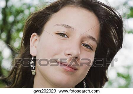 Portrait of a teenage girl smiling View Large Photo Image Stock Photo - Portrait of a teenage girl smiling. Fotosearch
