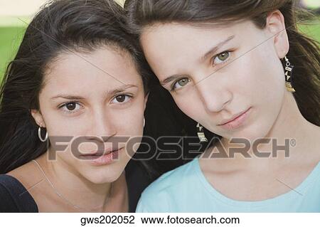 Stock Image - Portrait of a teenage girl with a young woman. Fotosearch
