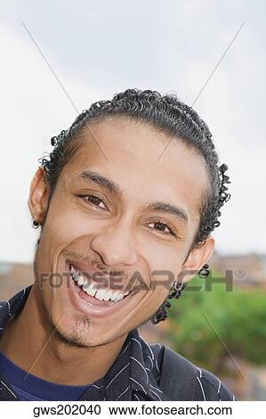 Portrait of a young man smiling View Large Photo Image Stock Image - Portrait of a young man smiling. Fotosearch