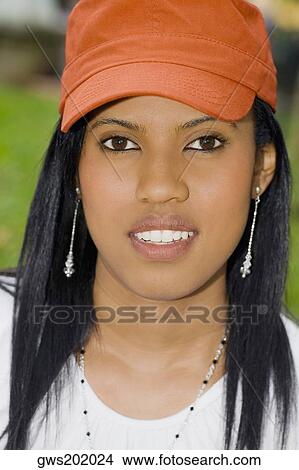 Portrait of a young woman smiling View Large Photo Image Picture - Portrait of a young woman smiling. Fotosearch