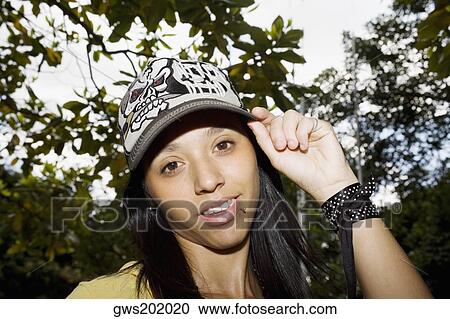 Portrait of a young woman smiling View Large Photo Image Stock Image - Portrait of a young woman smiling. Fotosearch
