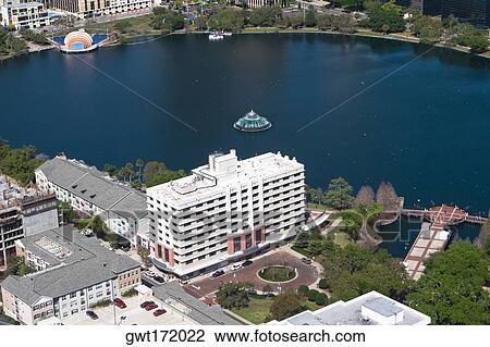Aerial view of buildings along a lake, Lake Eola, Lake Eola Park, Orlando, Florida, USA View Large Photo Image Stock Image - Aerial view of buildings along a lake, Lake Eola, Lake Eola Park, Orlando, Florida, USA. Fotosearch