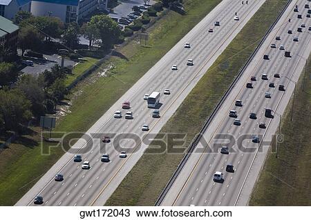 Aerial view of vehicles moving on a multiple lane highway, Interstate 4, Orlando, Florida, USA View Large Photo Image Stock Image - Aerial view of vehicles moving on a multiple lane highway, Interstate 4, Orlando, Florida, USA. Fotosearch