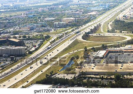 Aerial view of vehicles moving on multiple lane highways, Orlando, Florida, USA View Large Photo Image Stock Image - Aerial view of vehicles moving on multiple lane highways, Orlando, Florida, USA. Fotosearch