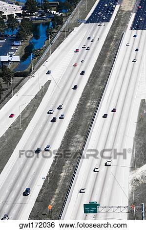 Stock Photograph - Aerial view of vehicles moving on multiple lane highways, Interstate 4, Orlando, Florida, USA. Fotosearch