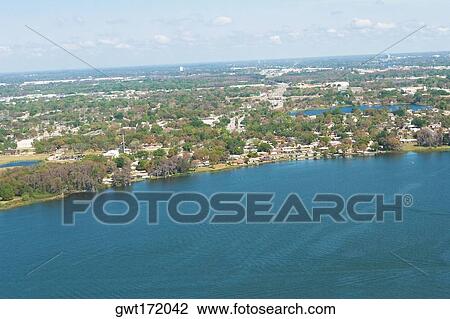 Stock Image - Buildings at the waterfront, Orlando, Florida, USA. Fotosearch