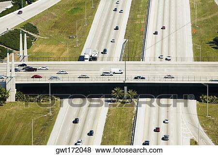 Vehicles moving on the road, Interstate 4, Orlando, Florida, USA View Large Photo Image Stock Photo - Vehicles moving on the road, Interstate 4, Orlando, Florida, USA. Fotosearch