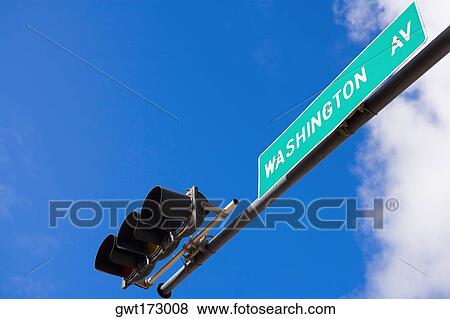 Low angle view of a traffic light and a signboard, South Beach, Miami Beach, Florida, USA View Large Photo Image Stock Photo - Low angle view of a traffic light and a signboard, South Beach, Miami Beach, Florida, USA. Fotosearch
