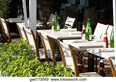 Tables and chairs in a restaurant, South Beach, Miami Beach, Florida, USA View Large Photo Image Stock Photo - Tables and chairs in a restaurant, South Beach, Miami Beach, Florida, USA. Fotosearch