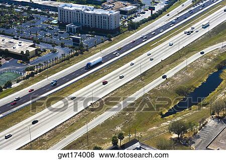 Aerial view of vehicles moving on multiple lane highways, Orlando, Florida, USA View Large Photo Image Stock Photo - Aerial view of vehicles moving on multiple lane highways, Orlando, Florida, USA. Fotosearch