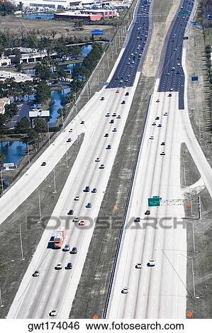 Aerial view of vehicles moving on multiple lane highways, Interstate 4, Orlando, Florida, USA View Large Photo Image Stock Photograph - Aerial view of vehicles moving on multiple lane highways, Interstate 4, Orlando, Florida, USA. Fotosearch