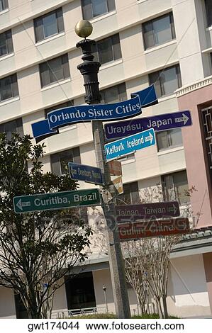 Picture - Directional sign in front of a building, Lake Eola Park, Orlando, Florida, USA. Fotosearch