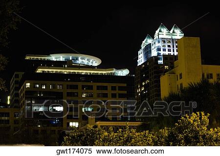 Stock Photography - Low angle view of buildings lit up at night, Orlando, Florida, USA. Fotosearch