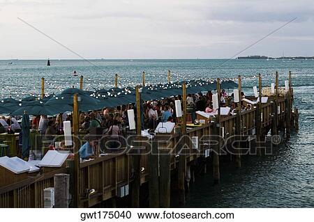 Group of people on a pier, Mallory Square, Key West, Florida, USA View Large Photo Image Stock Image - Group of people on a pier, Mallory Square, Key West, Florida, USA. Fotosearch
